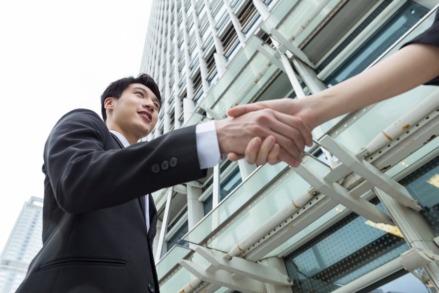 Asian Businessman Shaking Hand